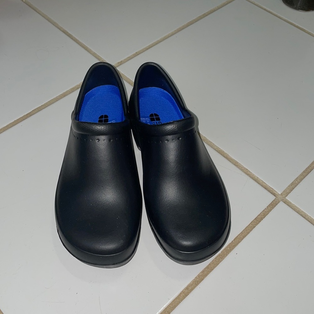 Black hospital clogs.